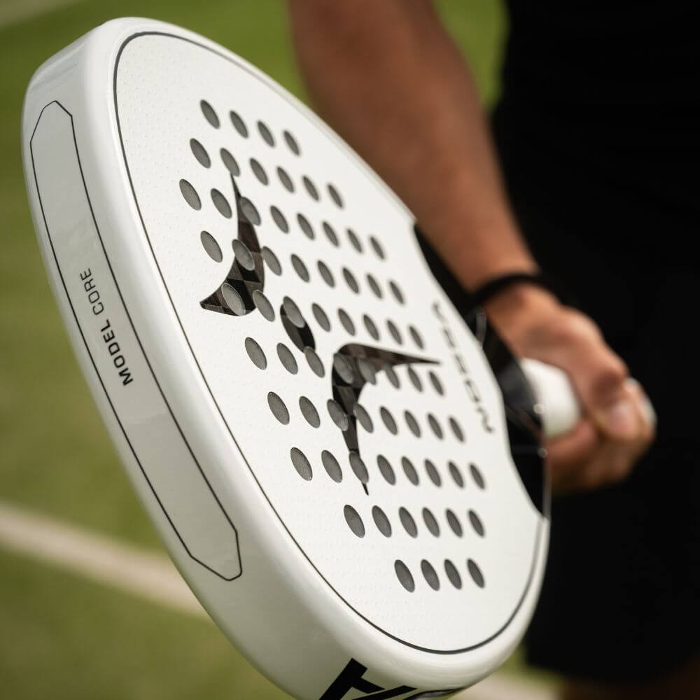 White Nossa Core Padel Racket Held By Padel Player